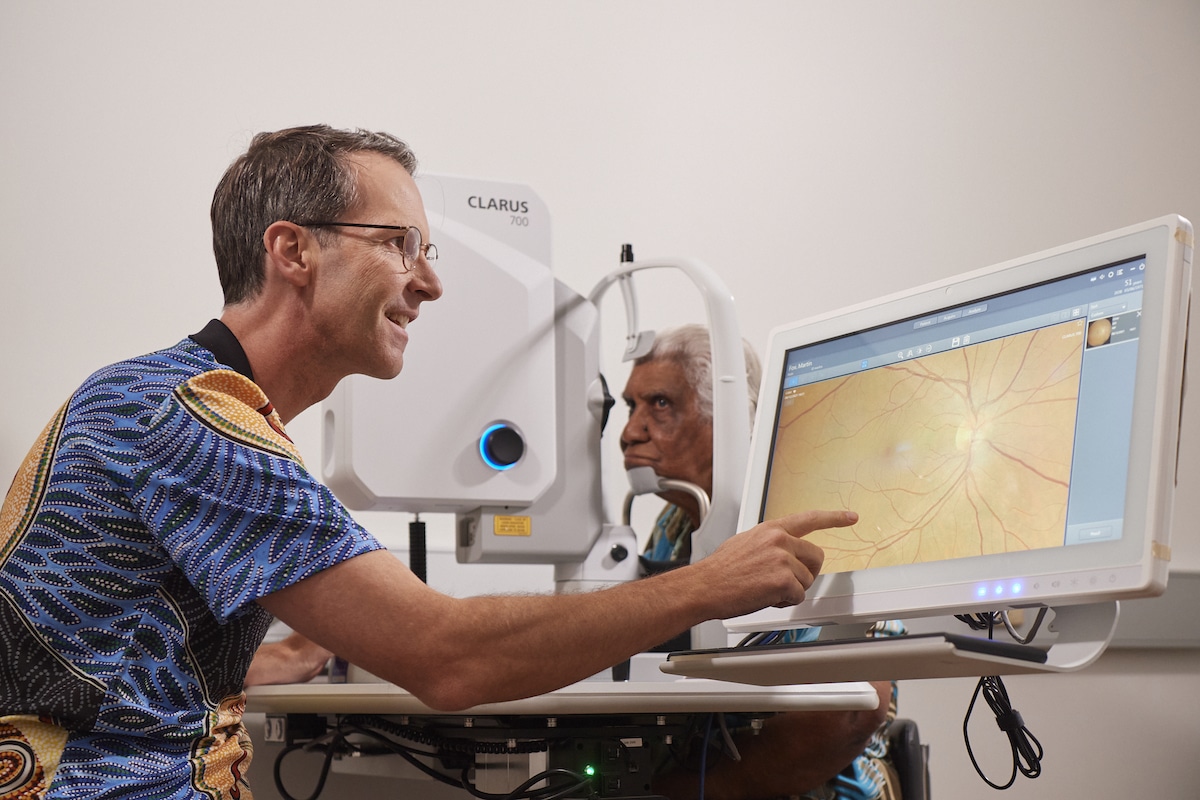 Dr Angus Turner assessing a retinal scan at the new Northwest Hub in Kimberley.