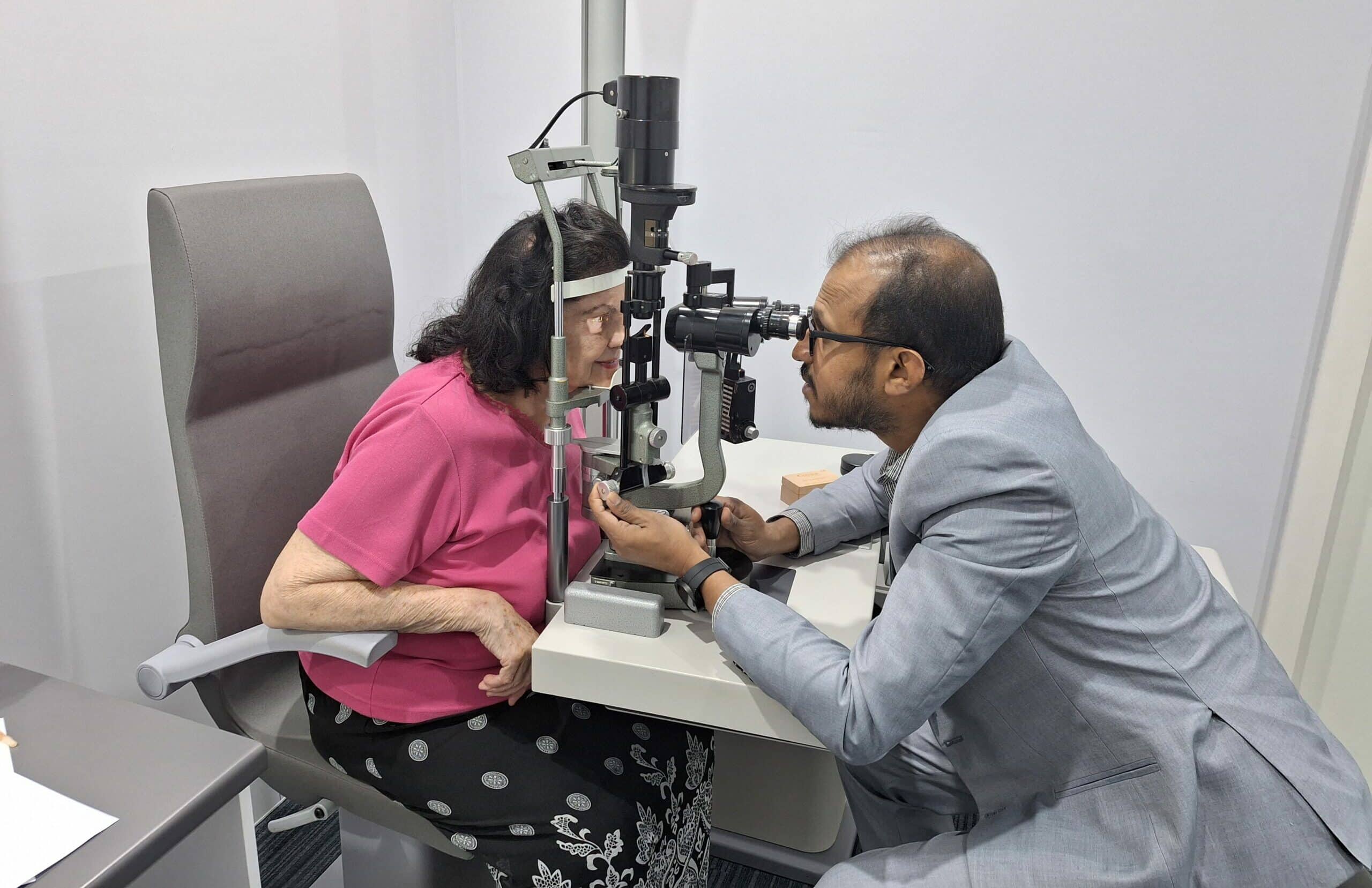 Dr Lasitha Jayasinghe assesses a patient post-cataract surgery.