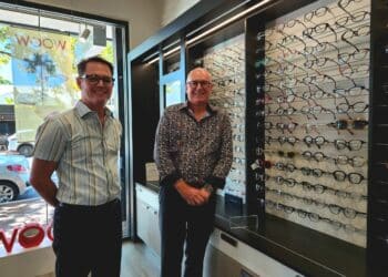 Business partners Wayne McCarthy (left) and Barry Telfer  and their Face à Face display within their Perth practice. Image: Angelo Street Optical.