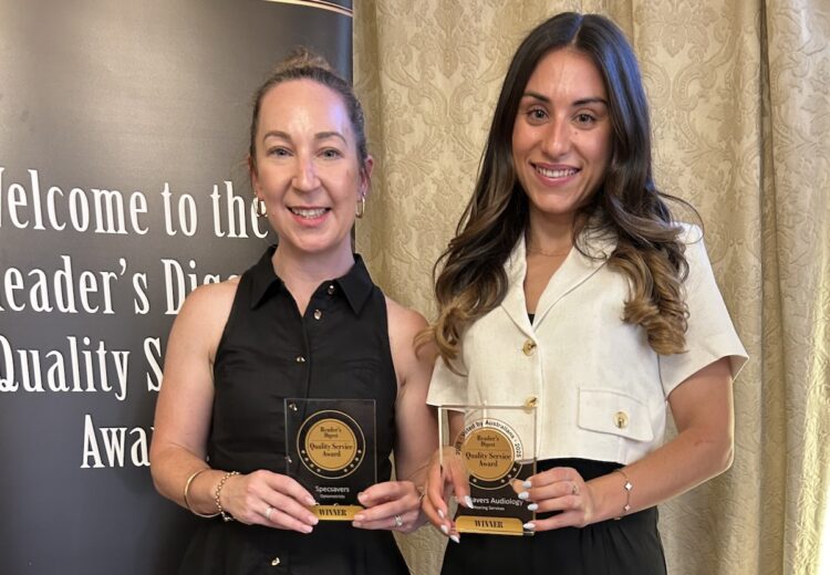 Michaela Cassidy (left), Specsavers head of customer operations, and Maree Patikas, audiology partner, Roseland, Bankstown and Chullora, with the company's Reader's Digest awards. Image: Reader's Digest.