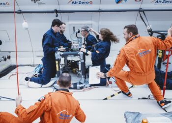 Dr Francesc March de Ribot (left) recording eye data in microgravity conditions inside a parabolic flight. Image: German Aerospace Centerand Novespace.