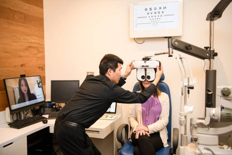 OPSM’s remote optometry journey, with the optometrist on screen and the in-person aspect by a technician. Image: EssilorLuxottica.