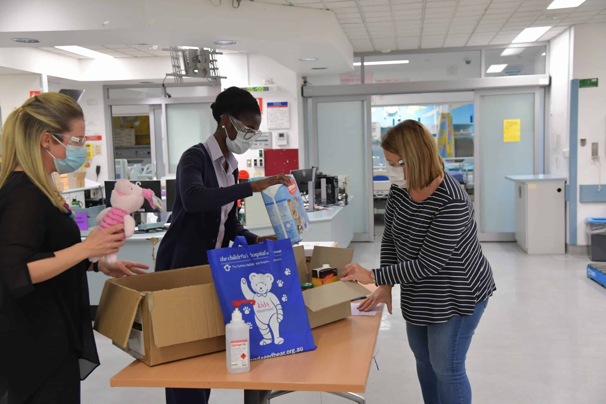The virtualKIDS ‘CORT’ logistics team packing essential items required to help a family care for their COVID-positive child at home.