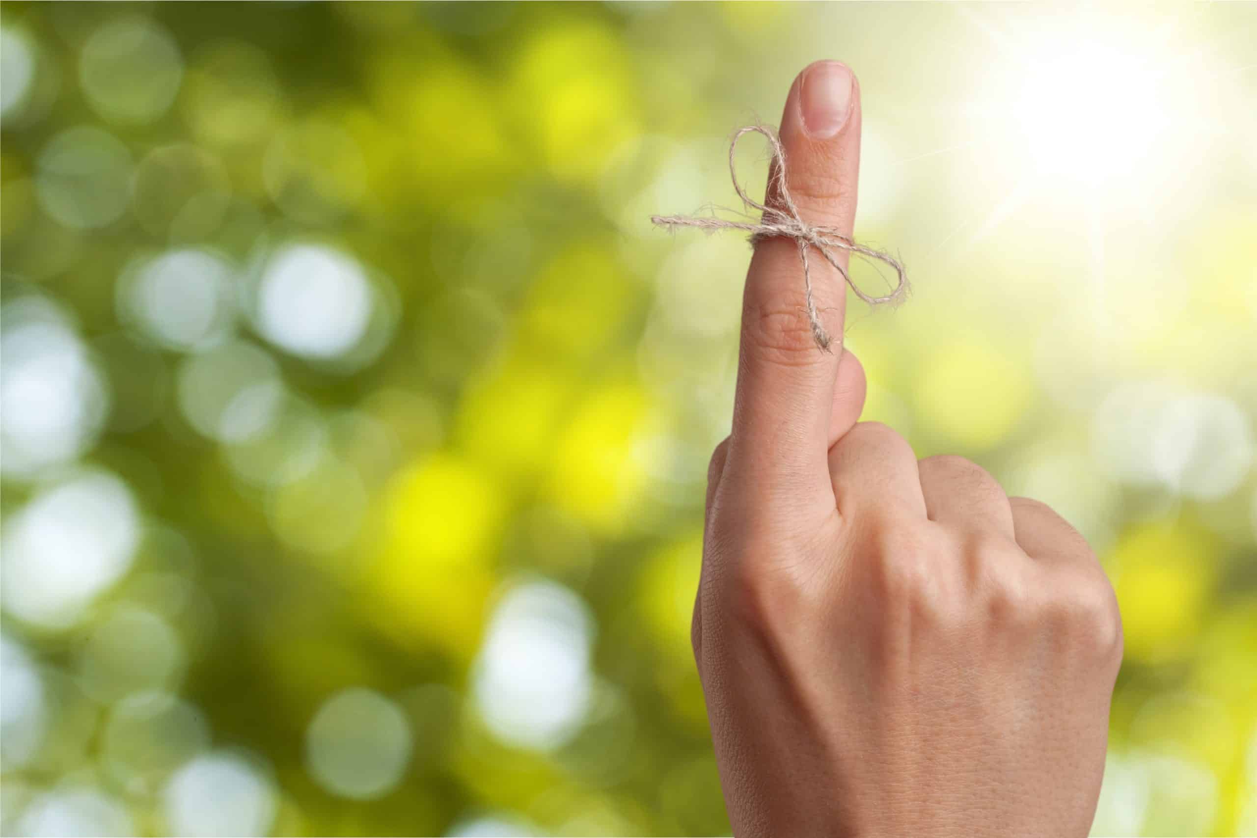 String tied around finger as a reminder